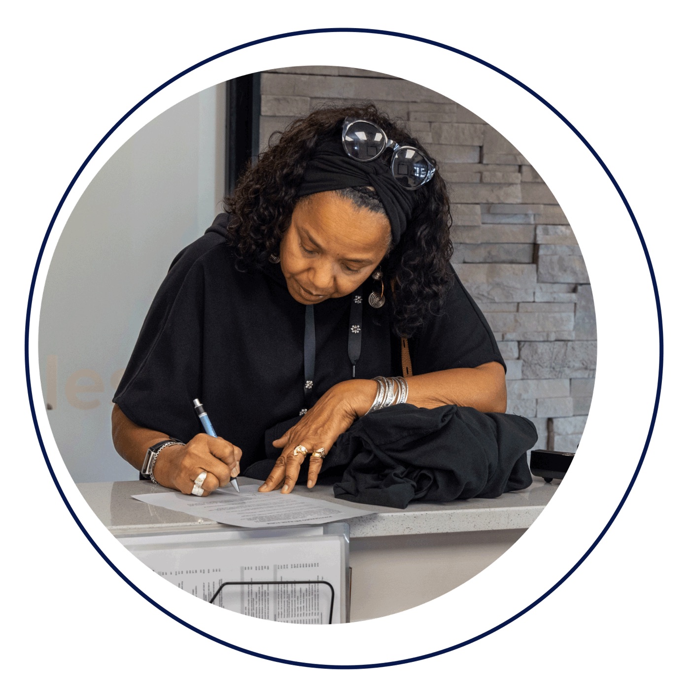 Patient filling out paperwork at CinciSmiles